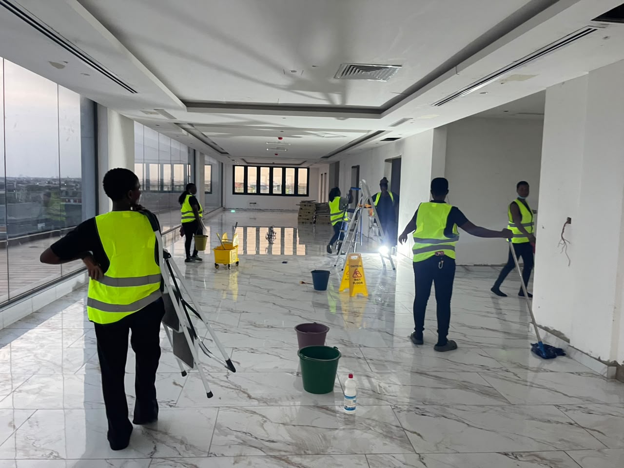 HFJS team deep-cleaning an auditorium carpet with industrial machines