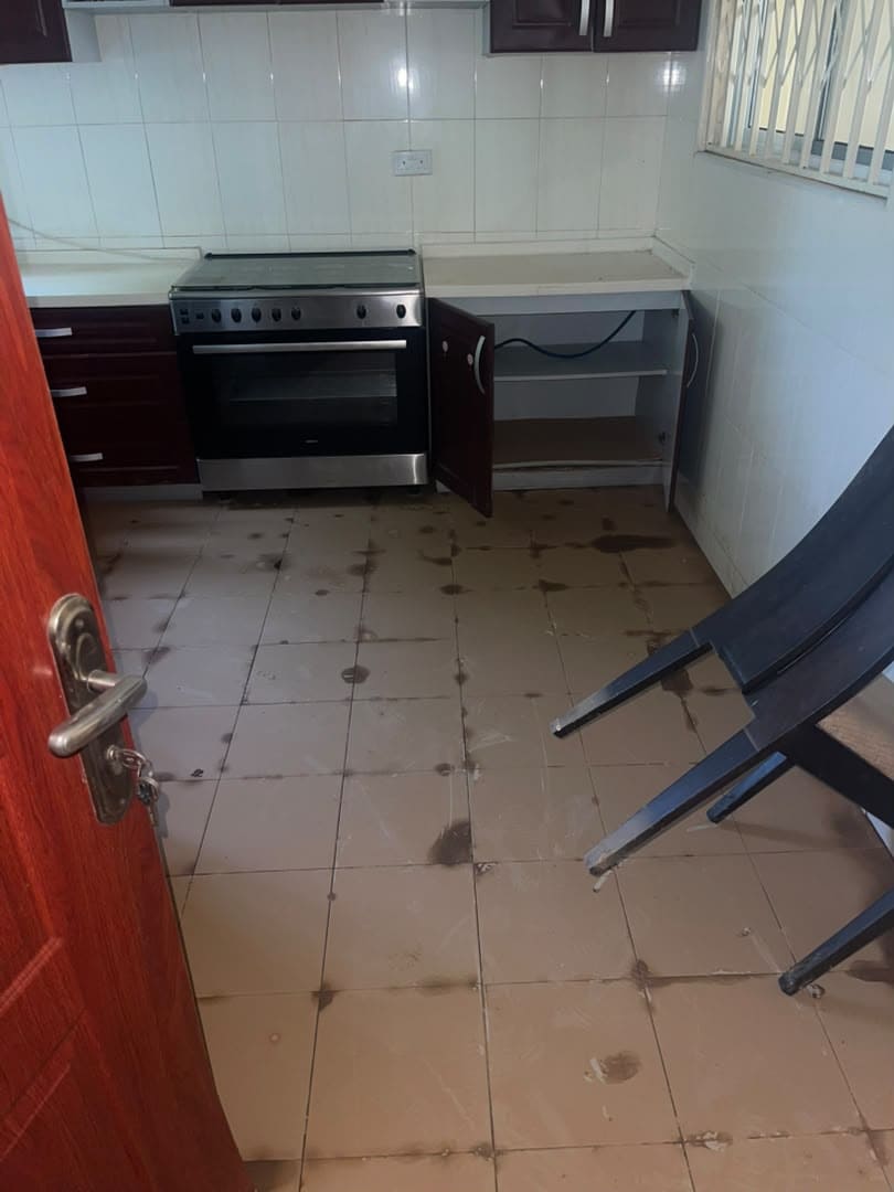 Kitchen floor stained and dirty before an HFJS deep clean